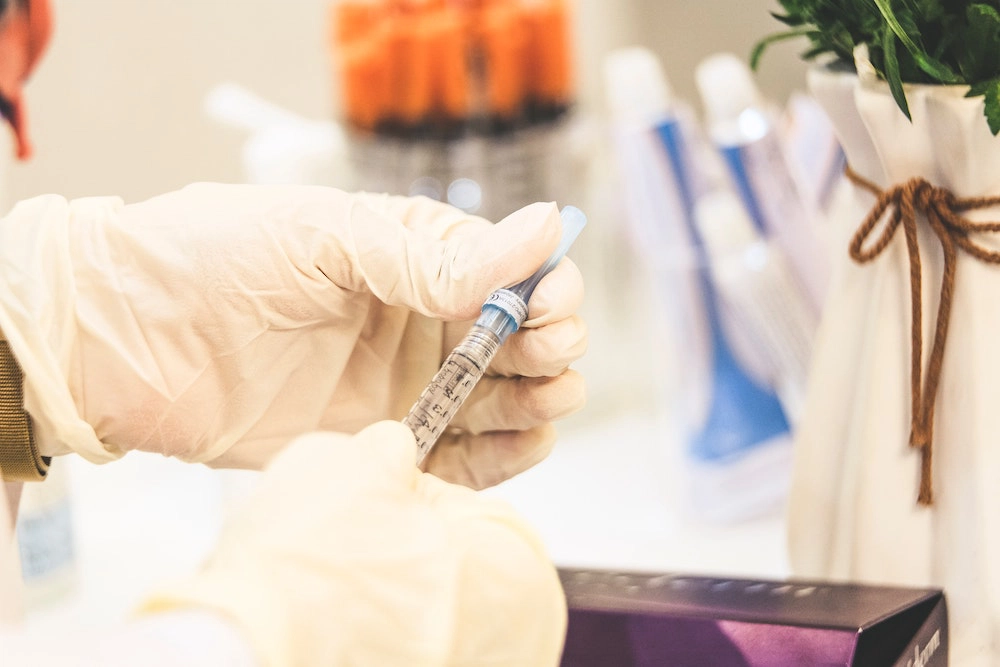 a doctor about to inject a needle