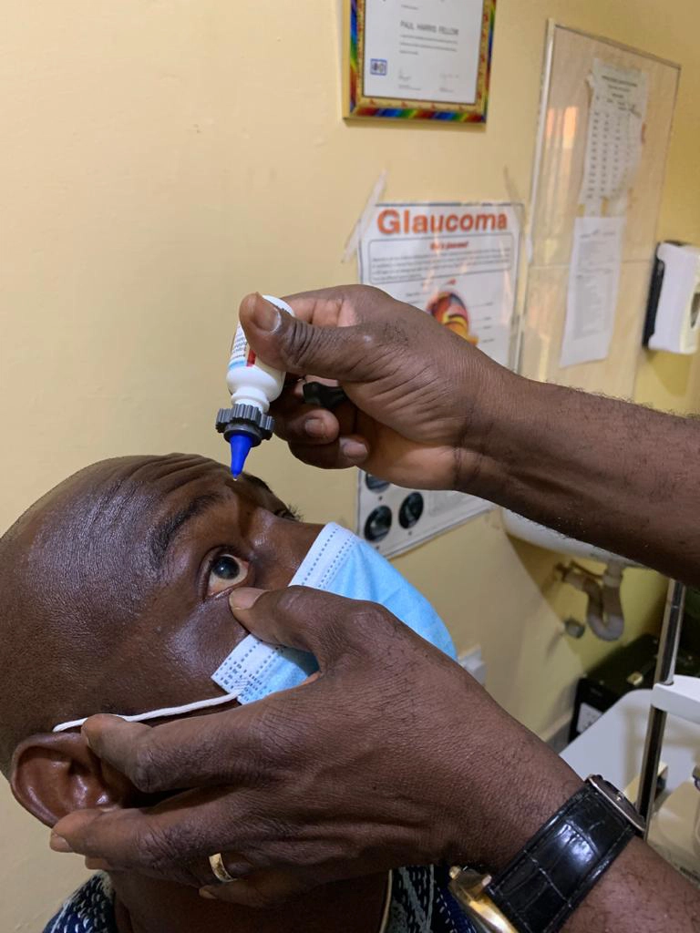a patient receiving an eyedrop with the nanodropper