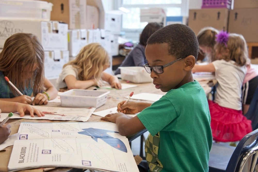 children getting an eye exam in a classroom