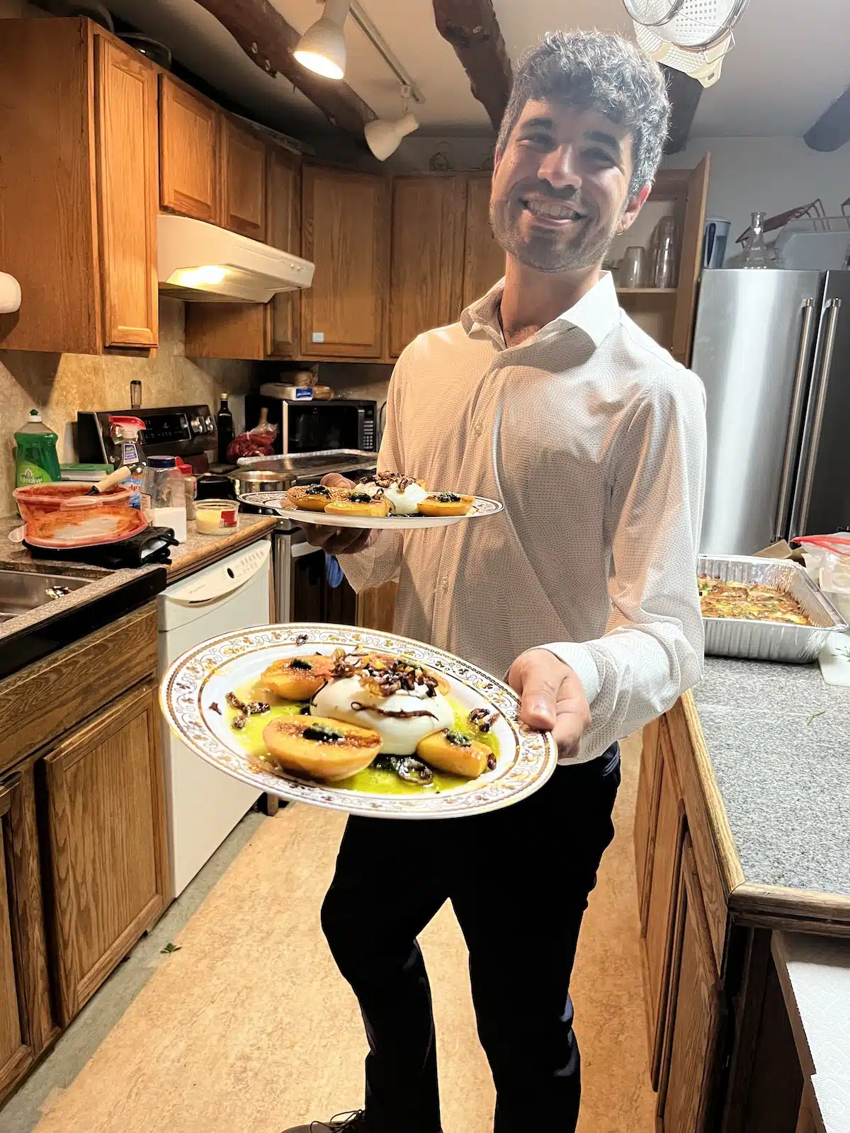 a man serving food in a kitchen